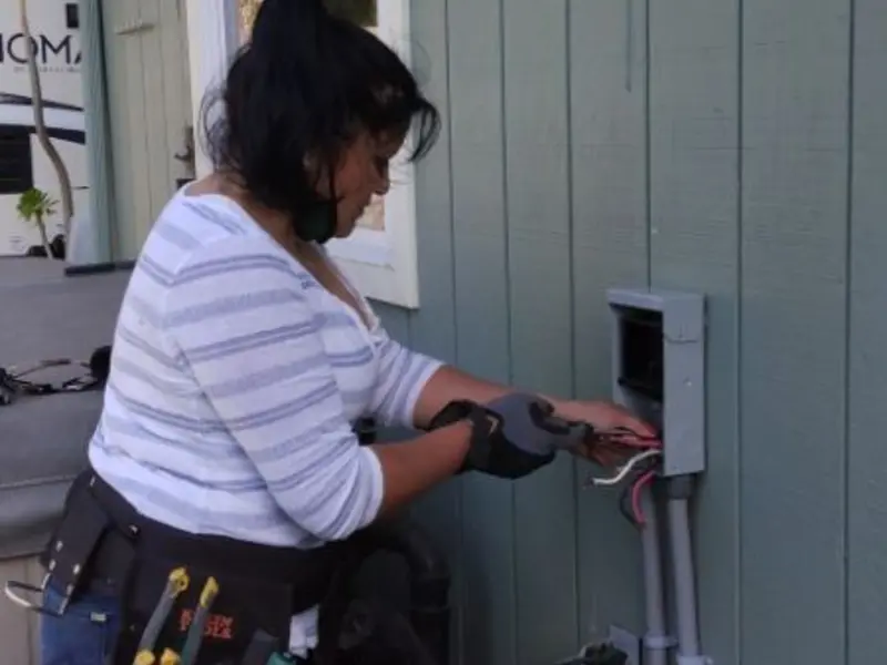Licensed electrician wiring an exterior subpanel in Lynbrook